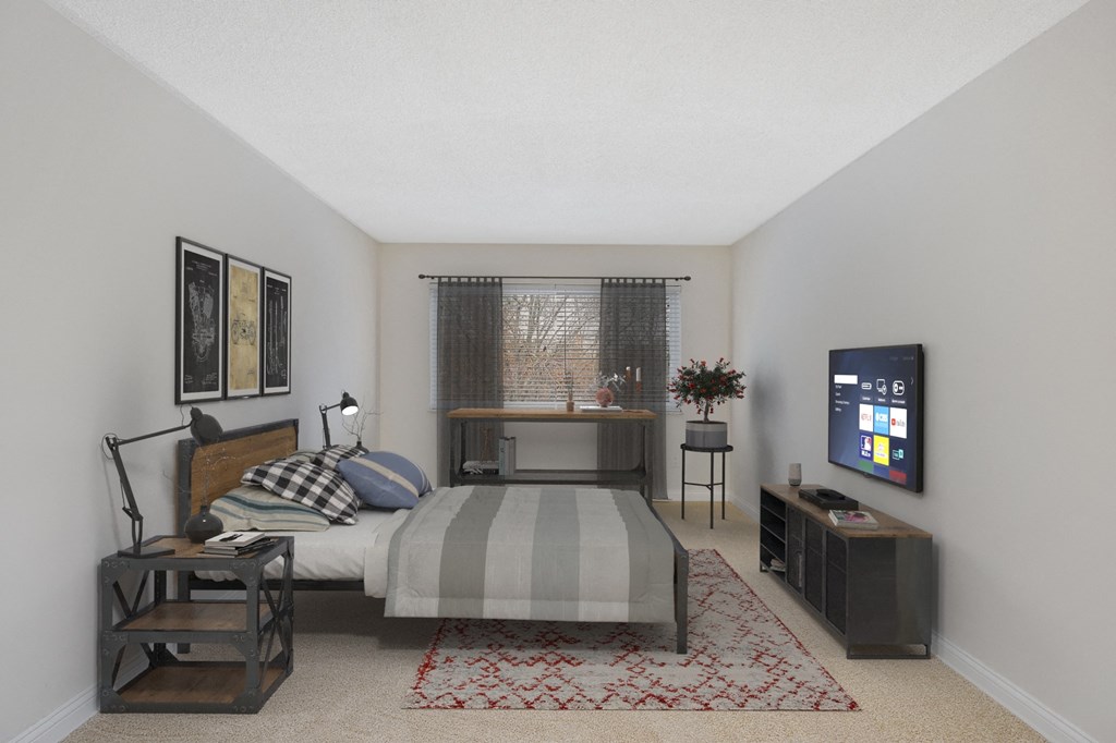 a bedroom with a bed and a television at Harpers Point Apartments, Ohio, 45249