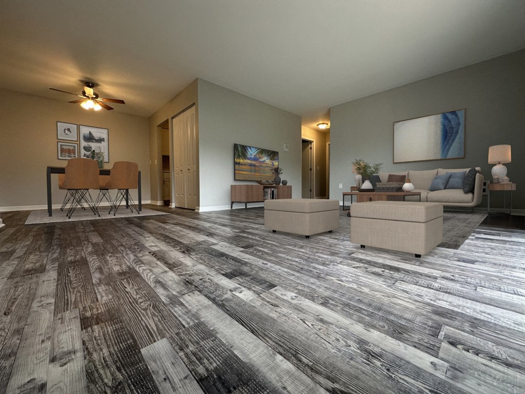 a living room with gray walls and a ceiling fan