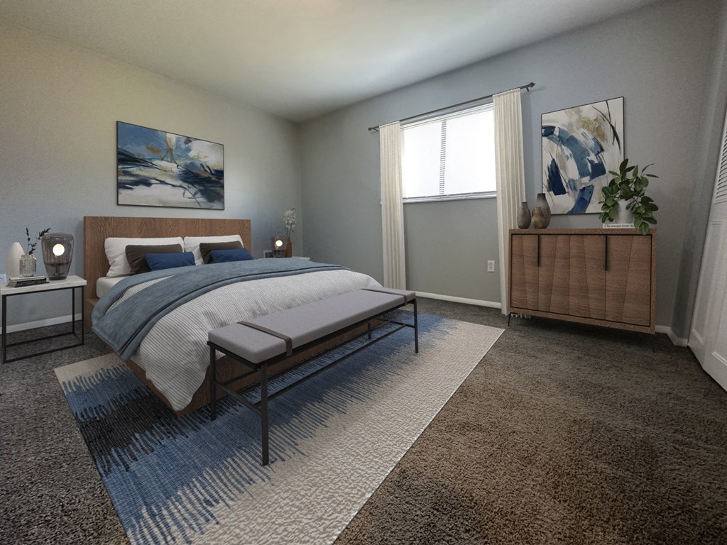 a bedroom with a bed and a dresser