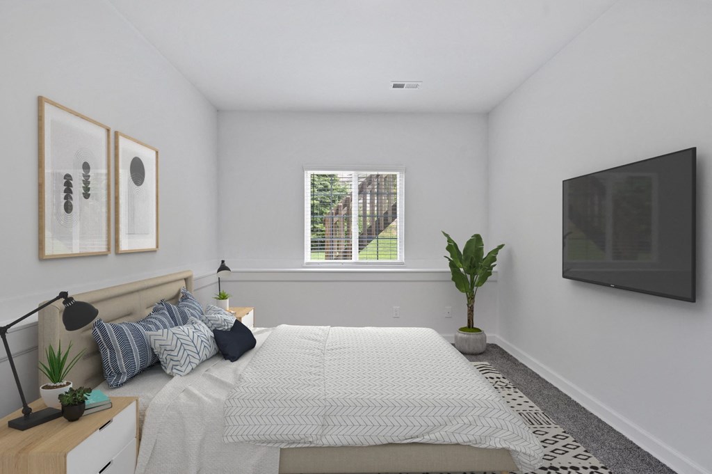 a bedroom with a large bed and a large window