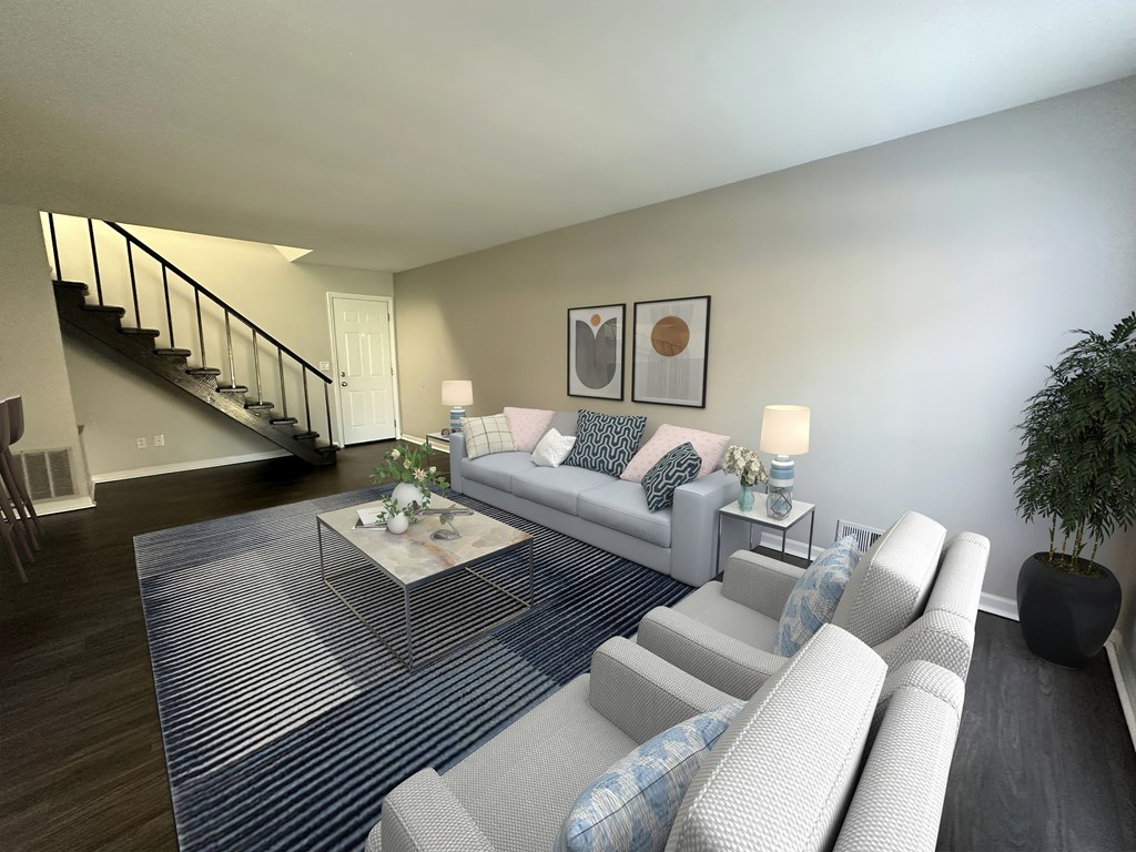 a living room with couches and a coffee table