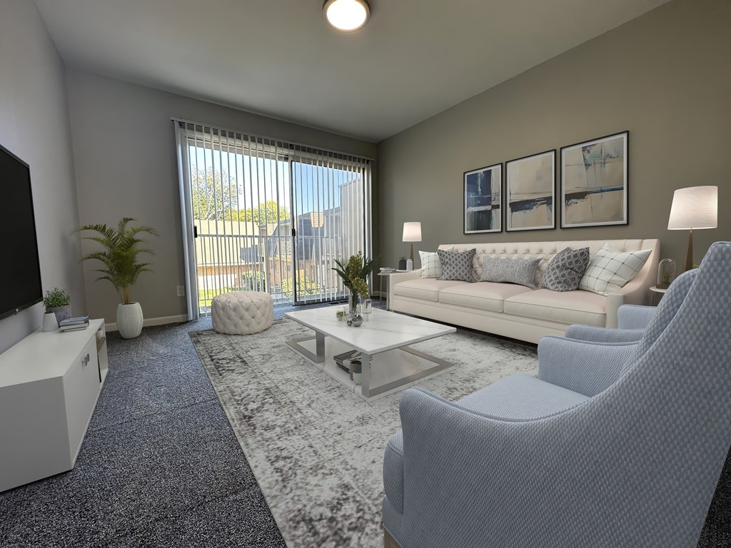 a living room with couches and chairs and a television