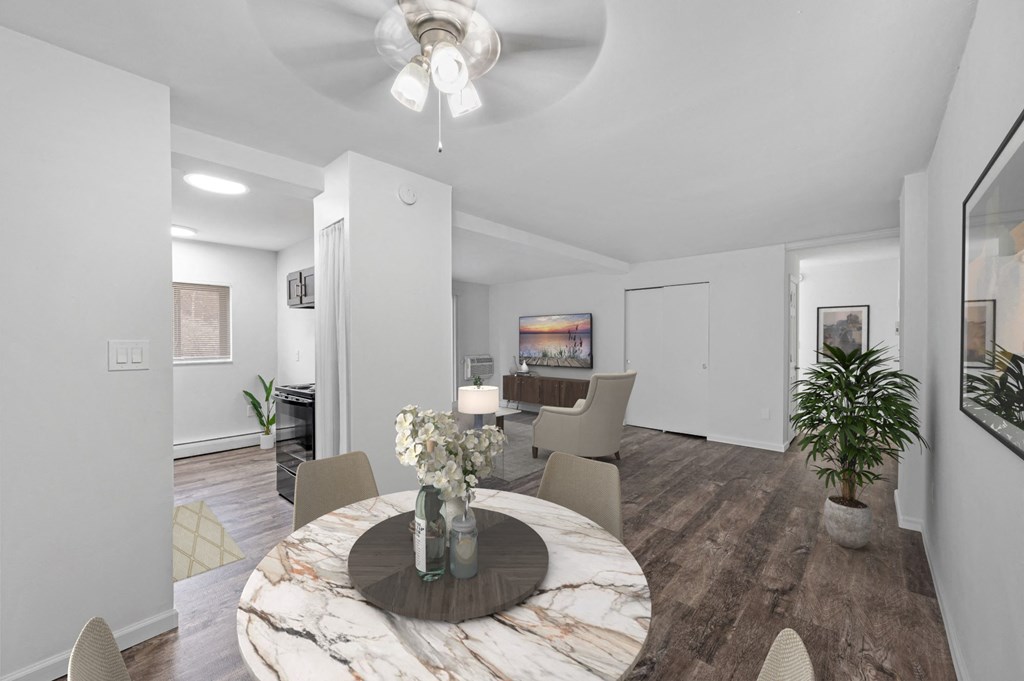 a dining room with a marble table and chairs