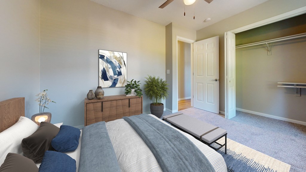 an open bedroom with a bed and a closet