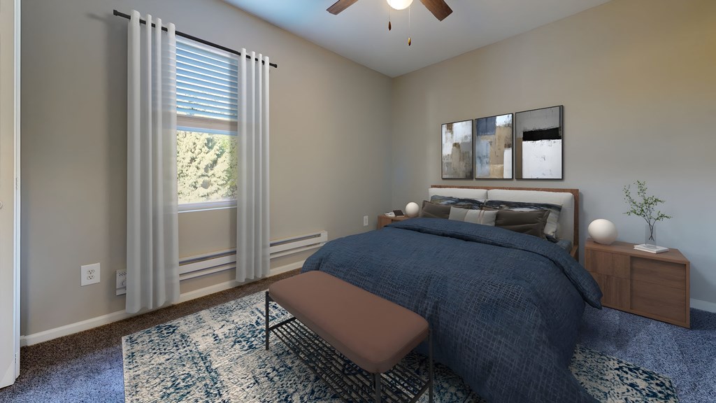 a bedroom with a large bed and a ceiling fan