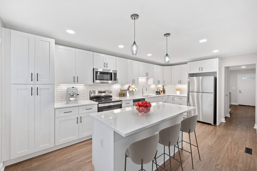 a large white kitchen with a white counter top at Indian Creek Apartments*, Cincinnati, Ohio