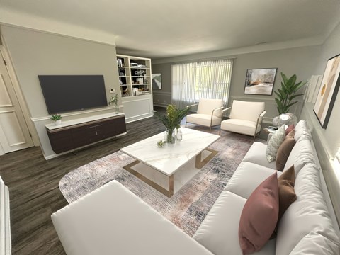 A living room with a white couch and a coffee table in the center.