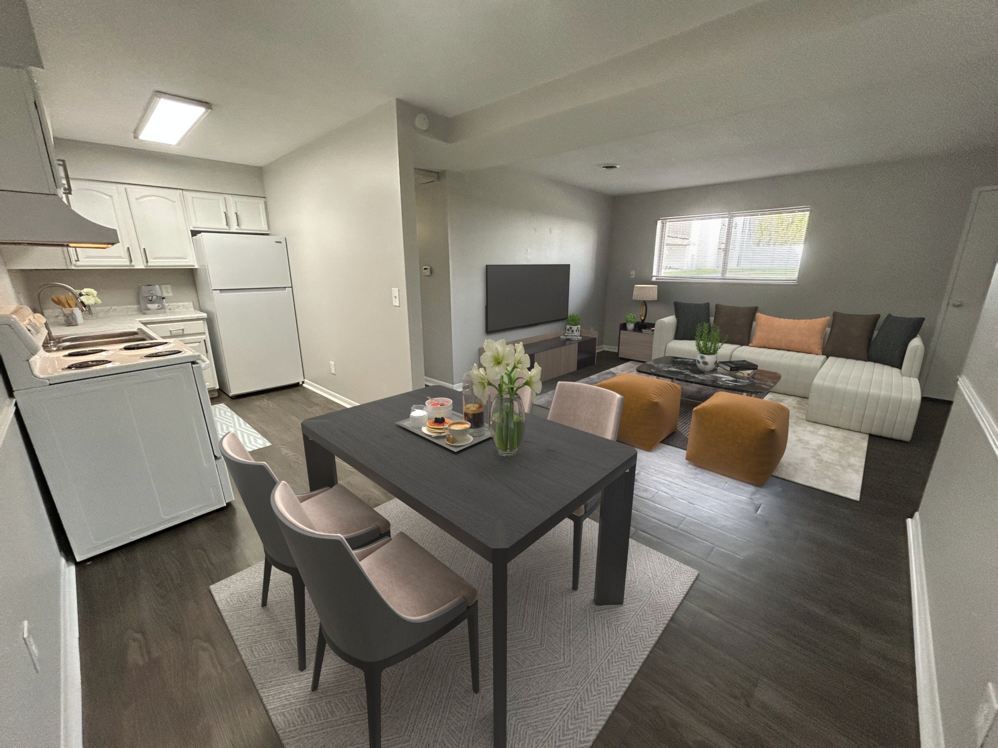 A modern kitchen with a dining table and chairs.