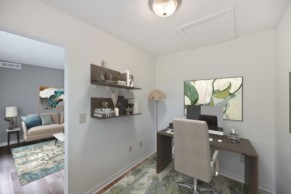 A room with a desk and a chair.