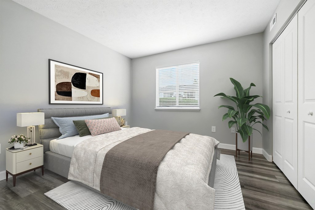 A bedroom with a bed, nightstand, and a painting on the wall.