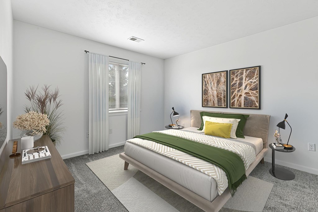 A bedroom with a bed, nightstand, and a painting on the wall.