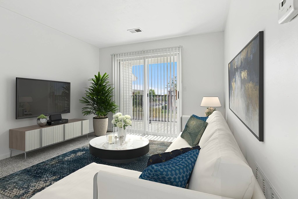 A living room with a white couch, a television, a plant, and a painting on the wall.