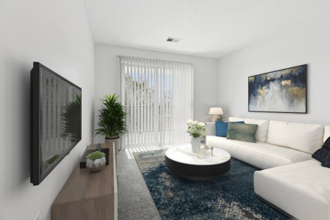 A modern living room with a white couch, a coffee table, and a painting on the wall.