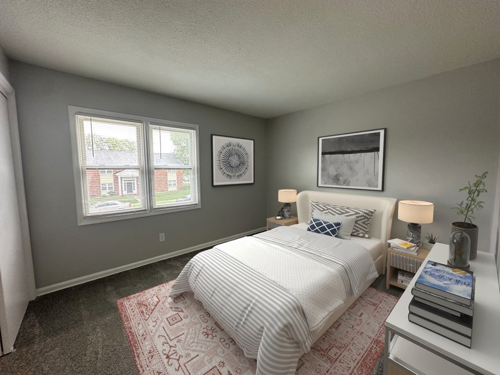 A bedroom with a bed, nightstand, and two framed pictures on the wall.