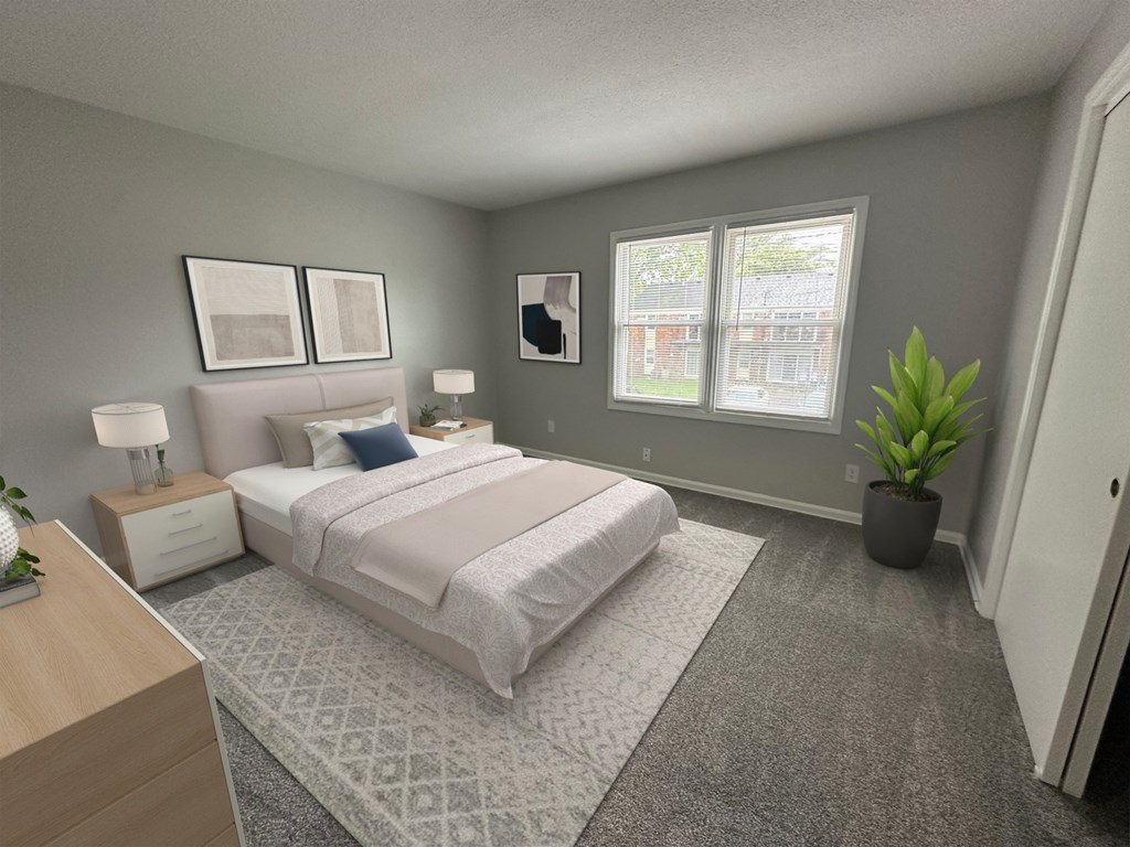 A bedroom with a large bed, two lamps, and a potted plant.