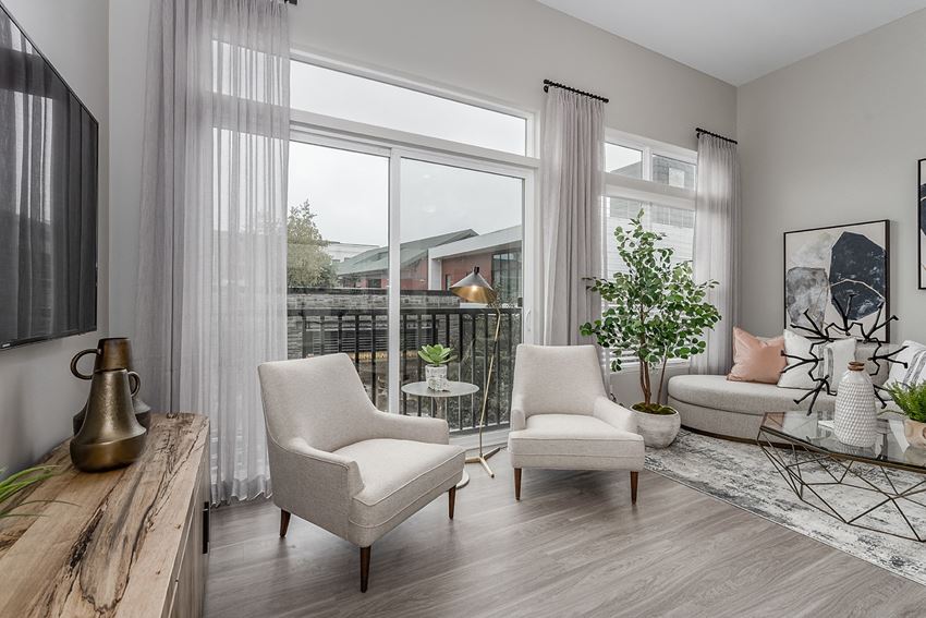 Apartments for Rent in West Chester- Liberty Center- Living Room with Floor-to-Ceiling Windows, Modern Decor and Wood-Style Floors - Photo Gallery