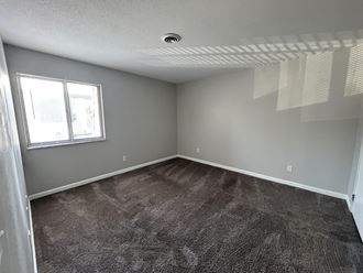 an empty room with a window - Photo Gallery 3