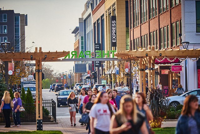 people walking down a busy street in a city