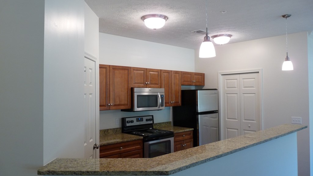 a kitchen with a granite counter top and