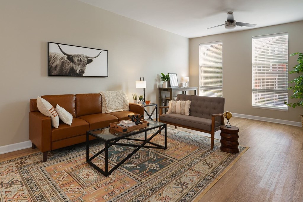 a living room with couches and a table at Adelphi Quarter, Columbus, OH