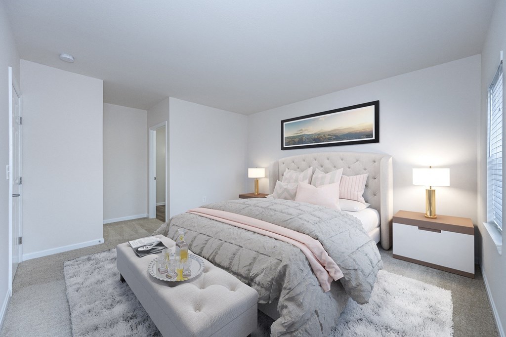 a bedroom with a large bed and a white rug