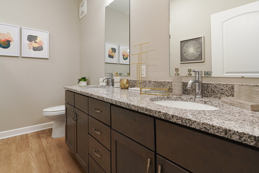 a bathroom with granite counter tops and two sinks at Adelphi Quarter, Ohio