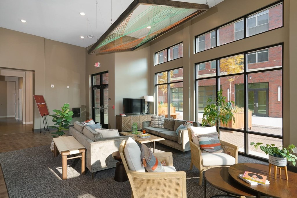 a lobby with couches and chairs and large windows at Adelphi Quarter, Ohio