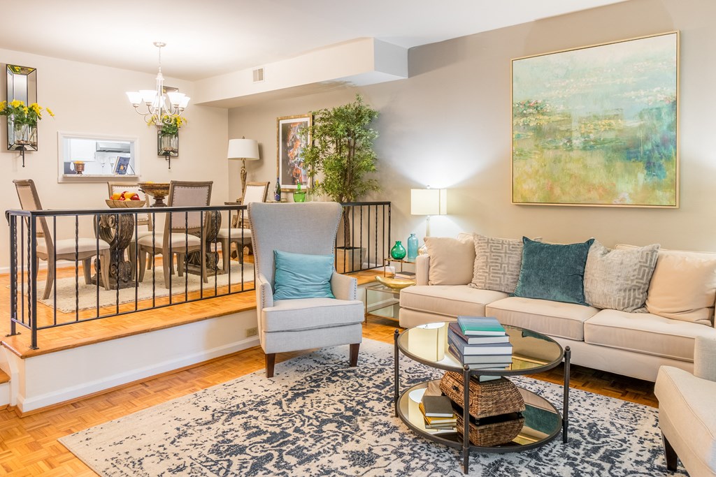 Living room with a couch and a table at Indian Creek Apartments, Cincinnati, OH