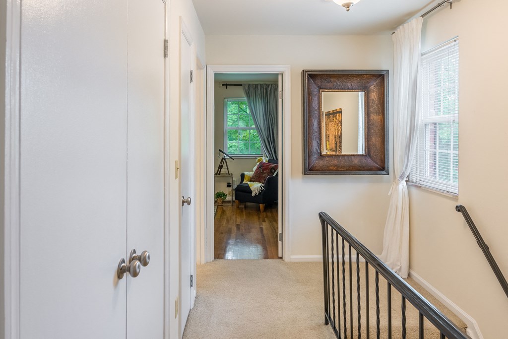 Stairs looking into the living room of a home at Indian Creek Apartments, Cincinnati, OH, 45236