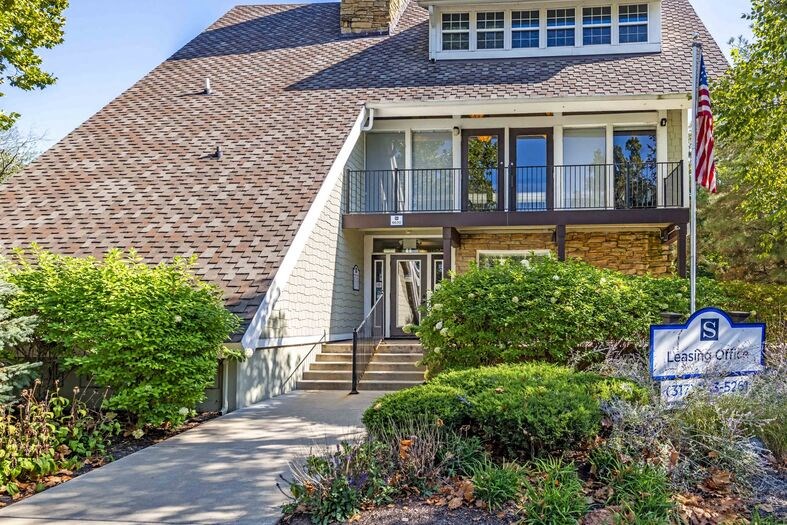 House with a flag and a sign in front of it at Summit at Keystone, Indianapolis, IN