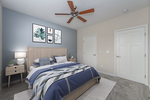 a bedroom with a bed and a ceiling fan