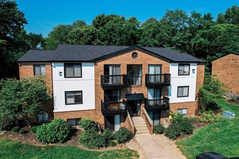 an aerial view of a brick apartment building with balconies