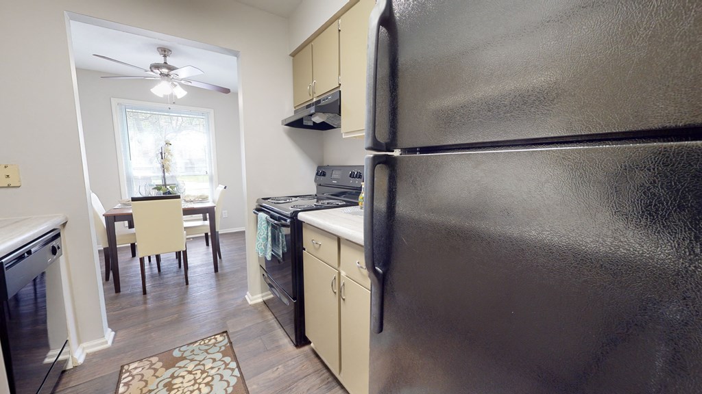 Kitchen and dining area in a 555 waverly unitat Summit at Keystone, Indiana, 46220