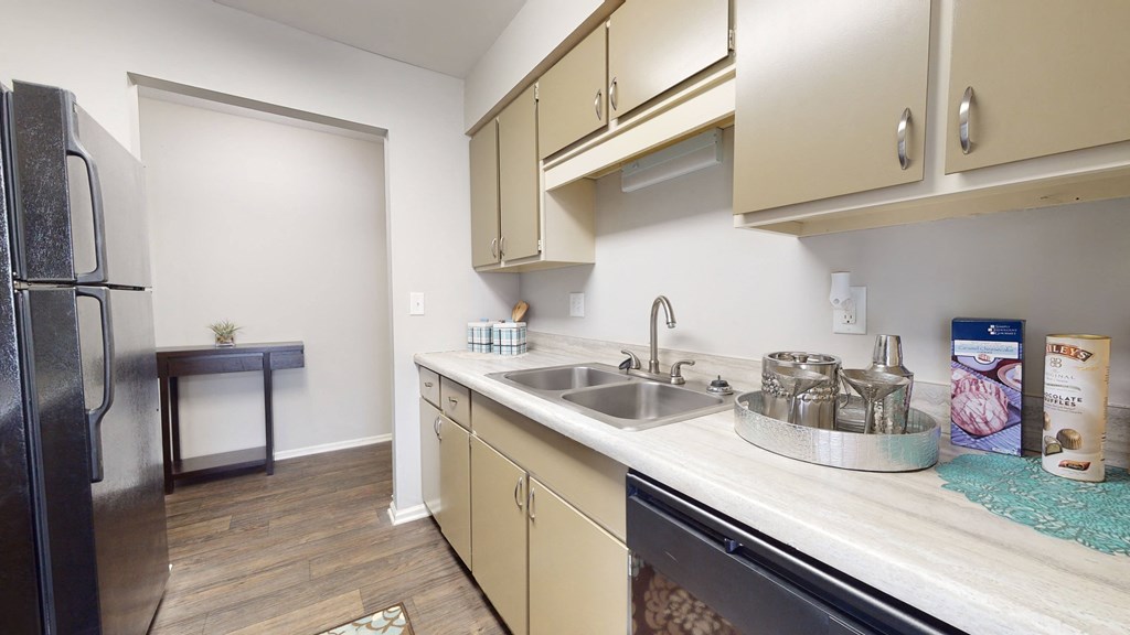 Kitchen with beige cabinets and stainless steel appliancesat Summit at Keystone, Indianapolis, IN 46220