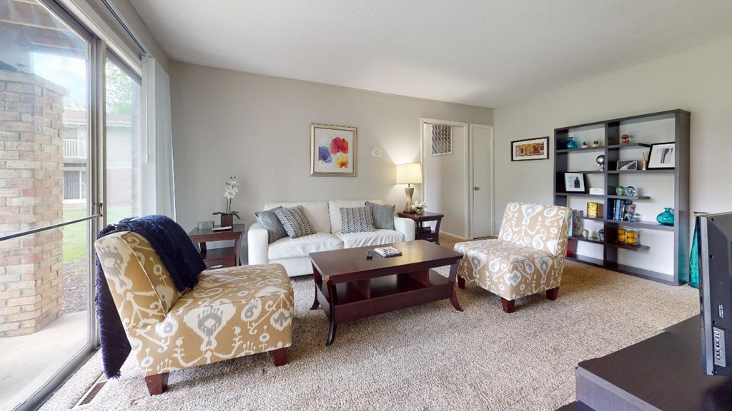 Living room with a couch chairs and a coffee table at Summit at Keystone, Indianapolis, IN 46220
