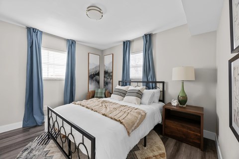 Bedroom with a large bed at The Rand Apartments, Columbus, OH
