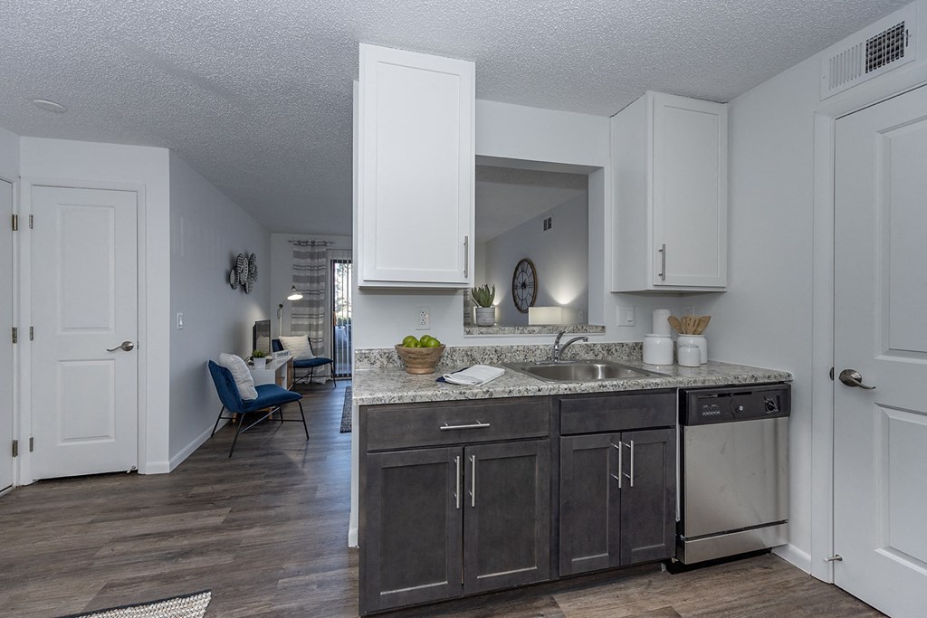Living room view of kitchen and dining1at Sandhurst Apartments, Zanesville