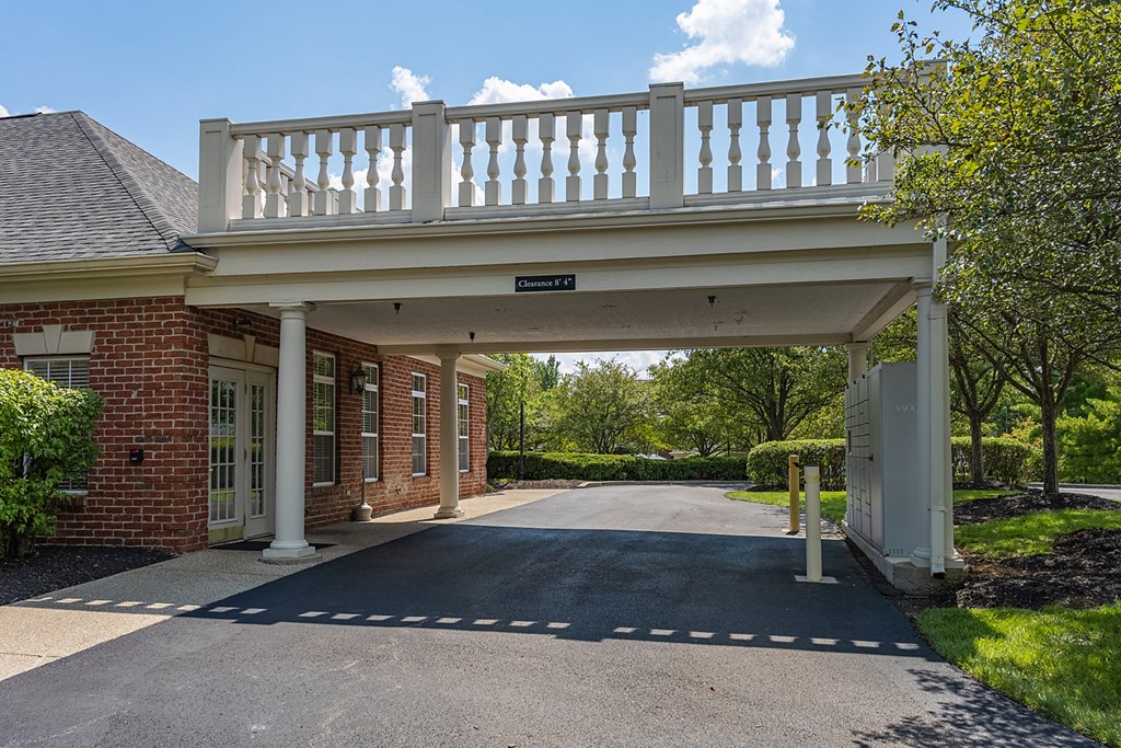 a house with a white balcony on top of a driveway at Bishops Gate, Ohio, 45249