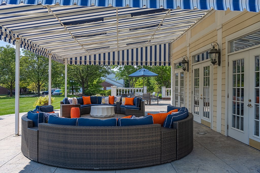 a covered patio with a blue and white striped awning at Bishops Gate, Ohio