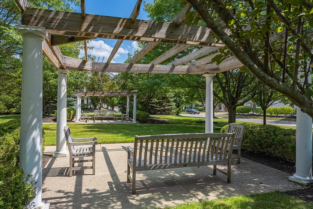 a bench sitting under a pavilion in a park at Bishops Gate, Cincinnati, OH, 45249