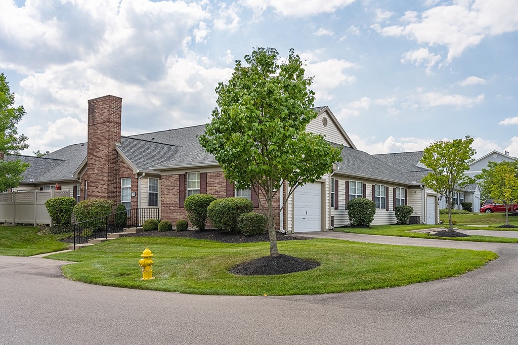 a house with a yellow fire hydrant in front of it at Bishops Gate, Cincinnati, OH, 45249
