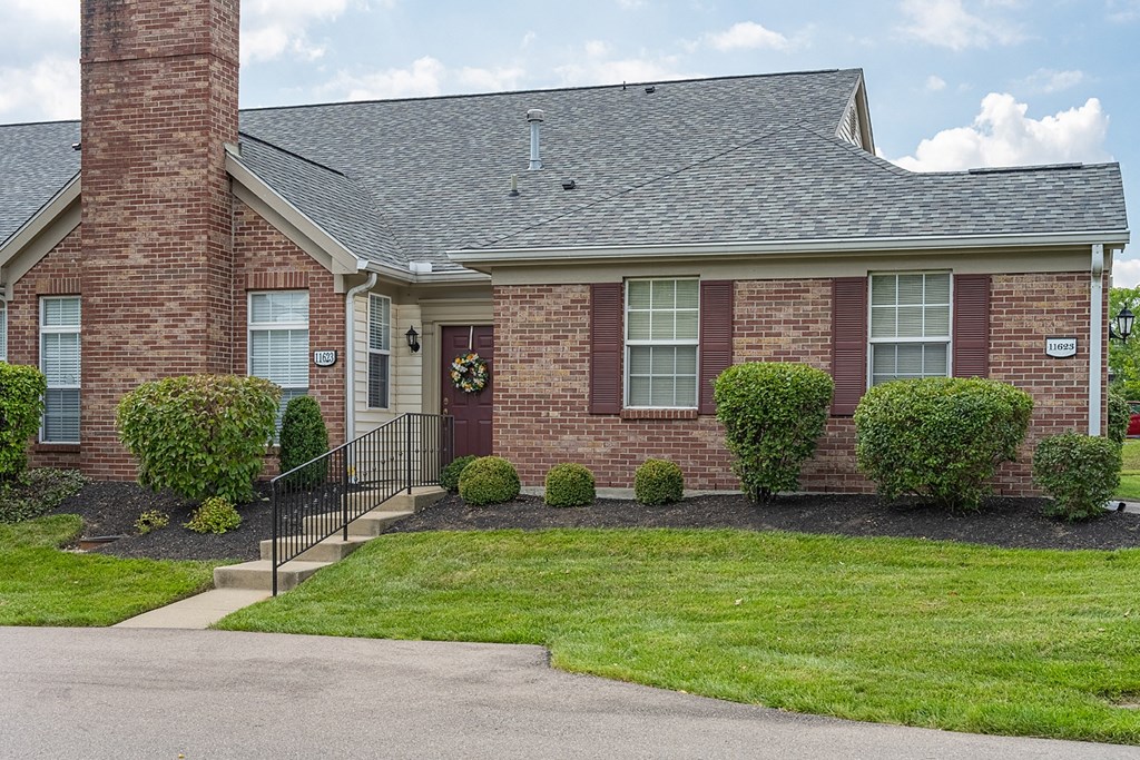 a brick house with a front yard and a stairway at Bishops Gate, Ohio, 45249