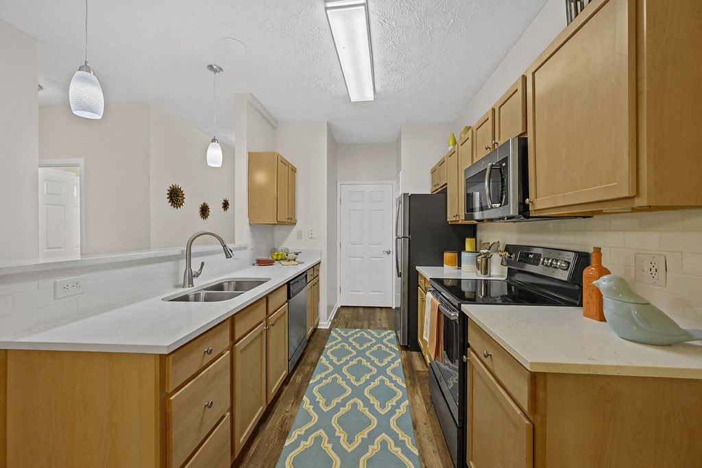 Kitchen with wooden cabinets and sink at Bishops Gate, Cincinnati, 45249