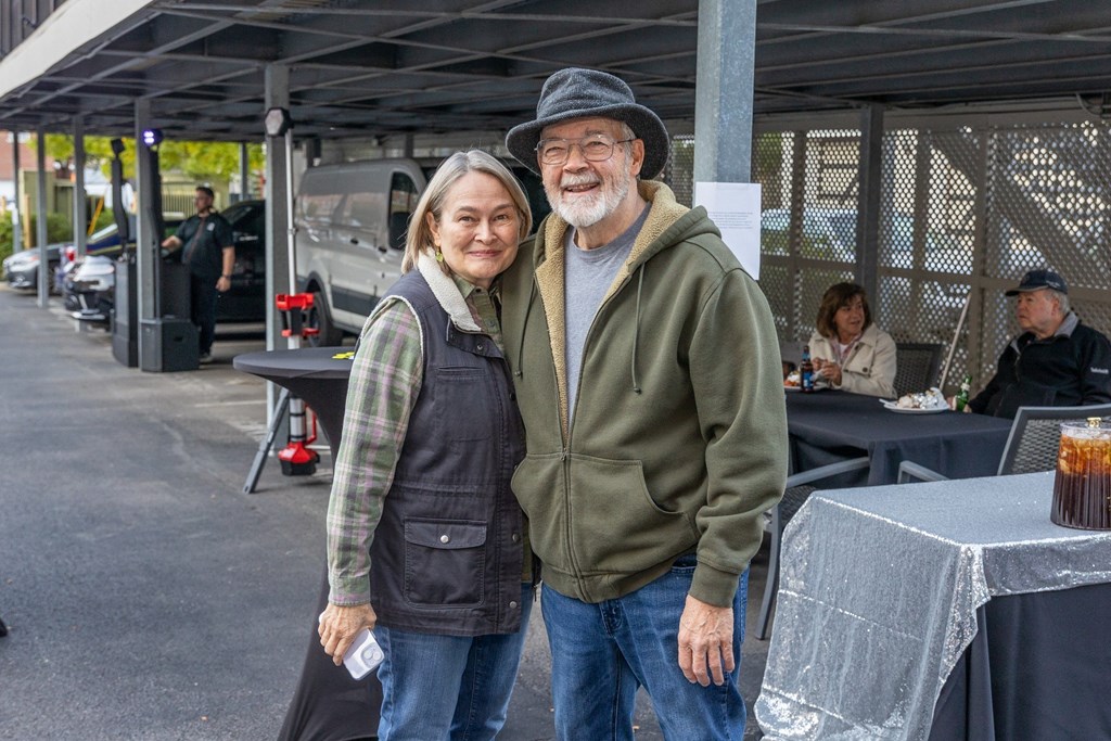 a man and a woman standing next to each other