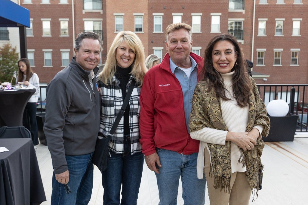 a group of people posing for a photo at an event