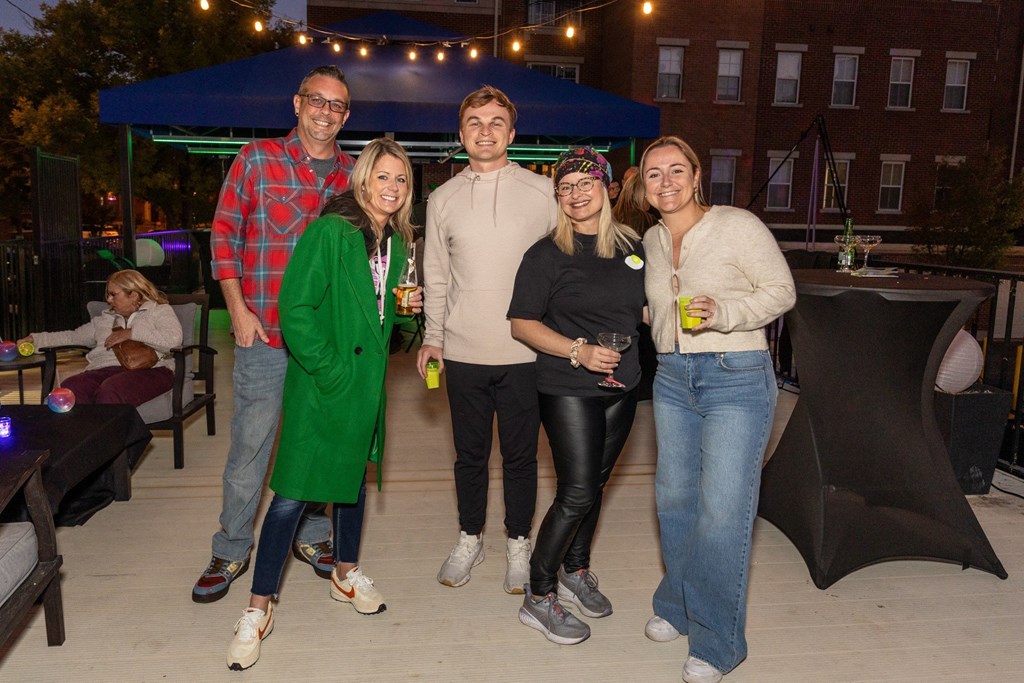 a group of people posing for a picture at a party