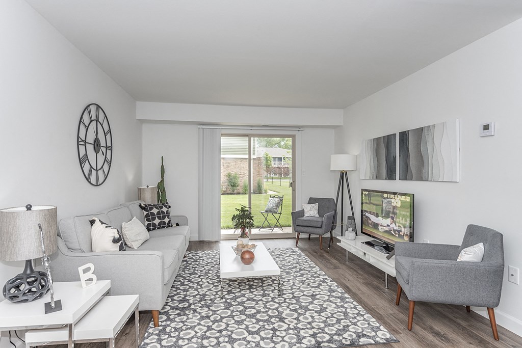 Living room with sofa and TVat Bloomfield Apartments, Dayton, OH
