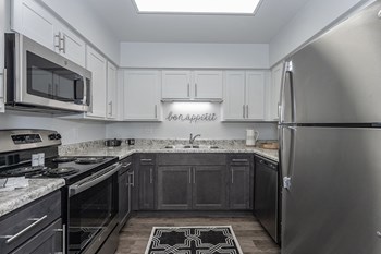 Modern Kitchen appliances and cabinets at Bloomfield Apartments, Ohio - Photo Gallery 3