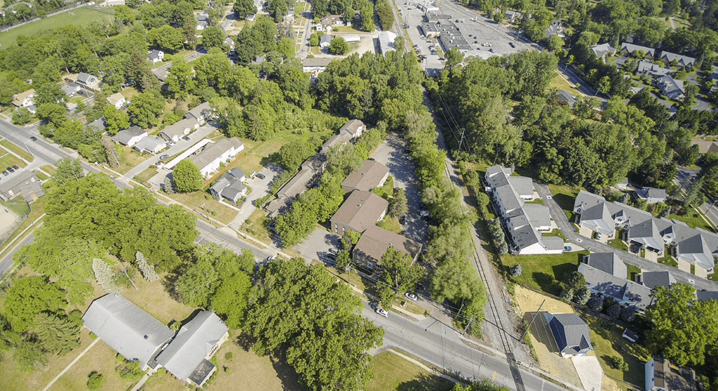 an aerial view of a neighborhood with houses and trees