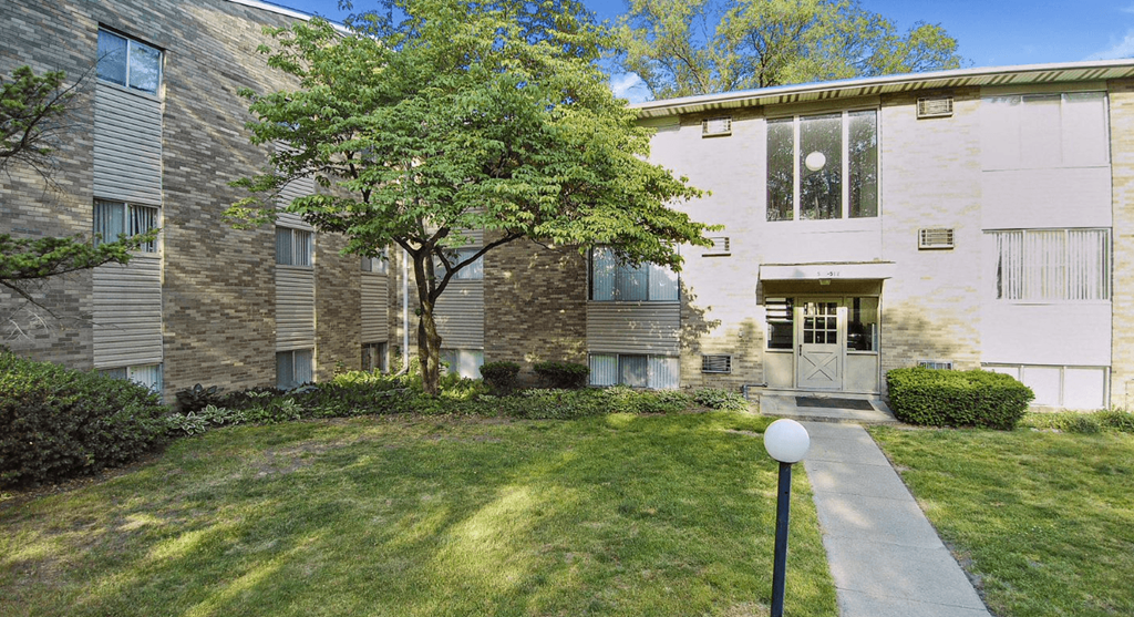 a building with a tree in front of it